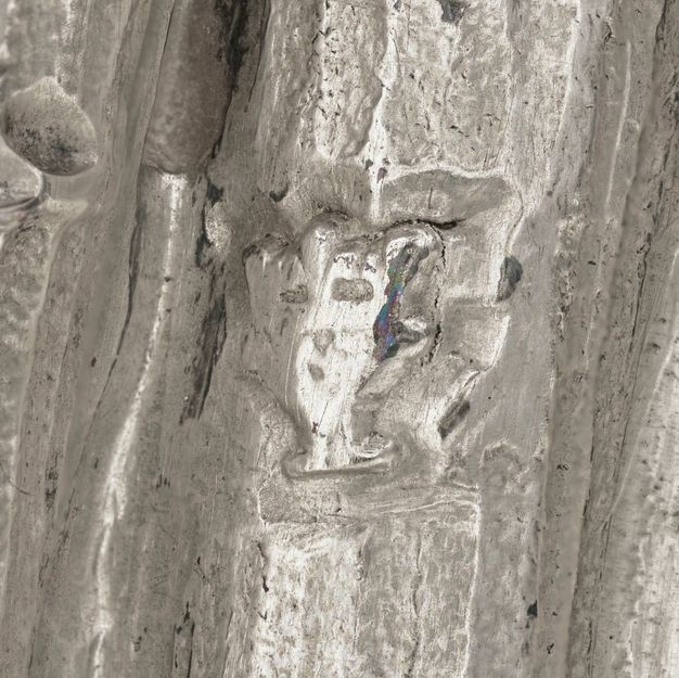 Close-up of a crowned Y stamped on the vessel.