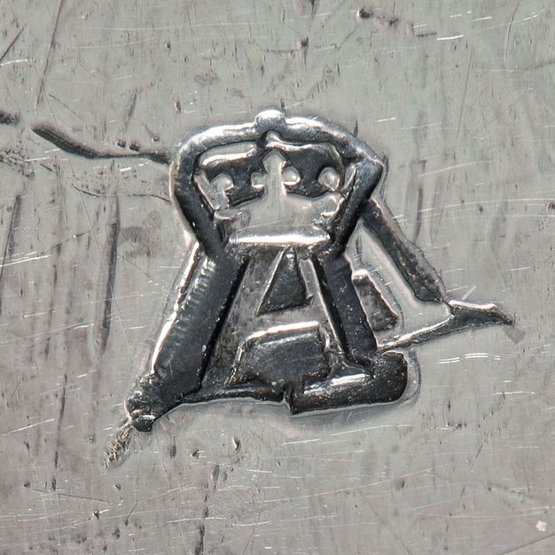 Close-up of a crowned A sttamped on the stand.