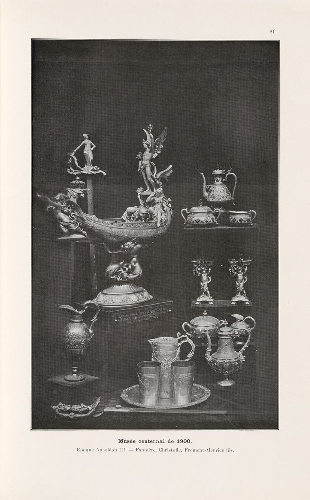 Black-and-white photograph from a book showing metal objects arranged in several tiers for a display.