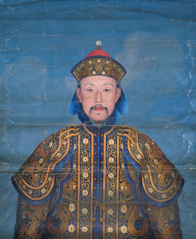 A hanging scroll bust portrait of a middle-aged man with wispy moustache and beard wearing elaborate blue-and-gold ceremonial armor and helmet, set against a sky-blue ground.