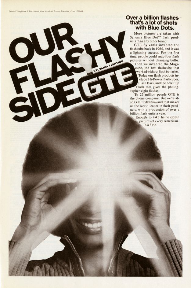 A black-and-white advertisement for flash products featuring an afroed woman. Turned toward the viewer, her face is almost completely obscured by a flash emanating from what we can barely make out as a camera held in front of her eyes.