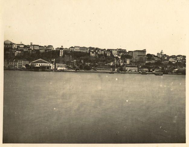 Sepia-toned coastal panorama, with a portion of the pier at lower left, taken and shown in two parts.
