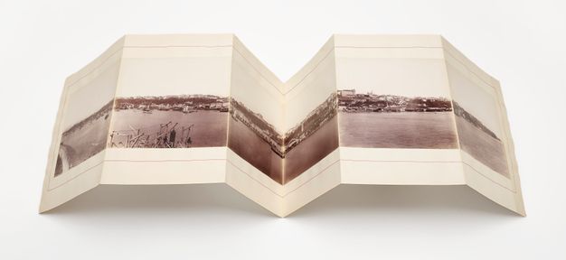 Recent photograph of this essay's figure one opened to show its materiality and the folding system.