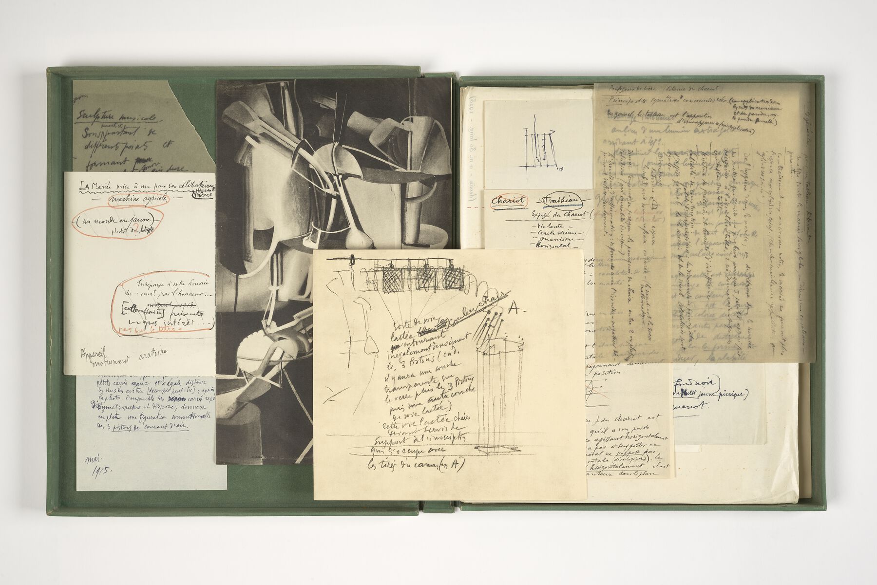 A green box displaying black and white lithographs with notes scattered throughout