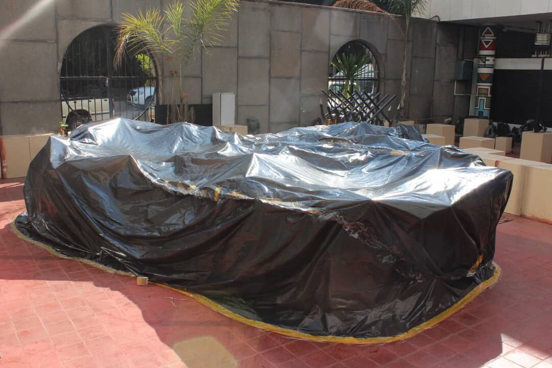 A chicken nest that is nicely covered by the black polyethylene fumigation sheet