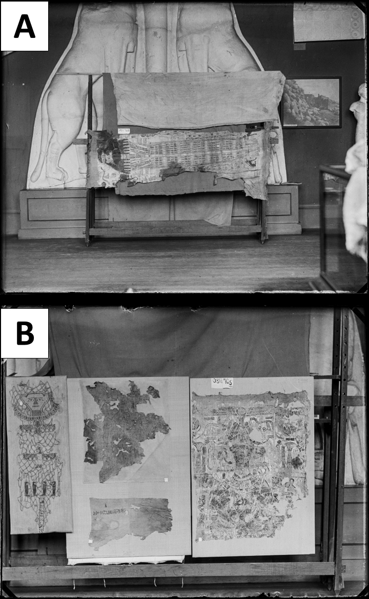 Black and white photographs of the Hathor shroud in image A and the Osiris shroud to the right in image B. The Hathor shroud hangs horizontally on display in front of two stone carvings that might be lions, though the image does not show the felines' heads. It bears a full-length figure of the deity Hathor. She has long hair that ends in thick curls and wears an embellished tunic that ends just above her sandaled feet. An undecorated column runs down the center of the dress from waist to ankles. There are considerable losses to the textile at the sides, as well as considerable staining. The Osiris shroud is shown next to the tattered remnants of two other textiles, one of which appears to be made of netting with multiple images of birds. Only the upper half of the Osiris shroud remains. It bears the likeness of the deity Osiris, who wears a false beard and atef crown and wields a crook and flail. There are considerable losses to the textile.