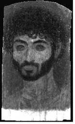 Grayscale image of a portrait of a man with dark curly hair and a full beard.