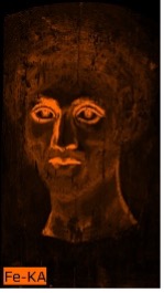 Portrait of a man where the outline of his eyes, nose, and lips appears in bright orange indicating the presence of iron pigments in these areas.