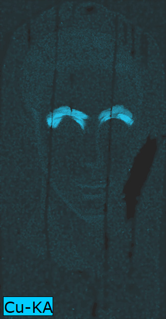 Dark rendering of a portrait highlighting in bright blue the presence of copper. This image is mostly dark except the eyebrows of the individual depicted which appear in bright blue.