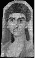 Grayscale image of a portrait of a woman with dark hair pulled back where it is loose. She has prominent dark eyebrows and eyes. She wears earrings and a tunic. Her features are not clearly delineated.