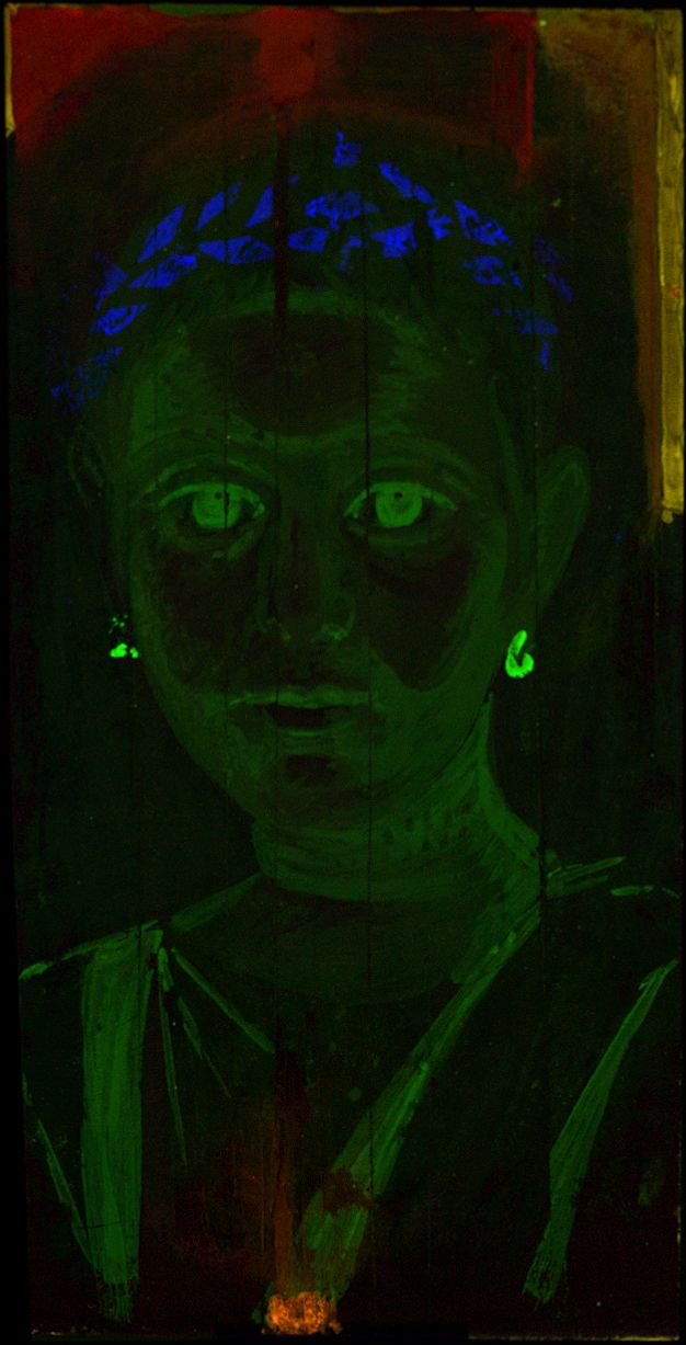 False-color MA-XRF map of the girl's portrait showing red in the pendant of her necklace and above her head, bright green for the earrings, and a less vibrant green for her eyes, skin, and tunic. The wreath in her hair appears bright blue.
