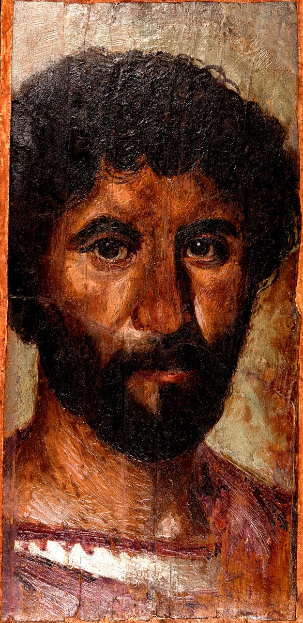 Portrait of a bearded man with dark curly hair. He wears a purple cloak.