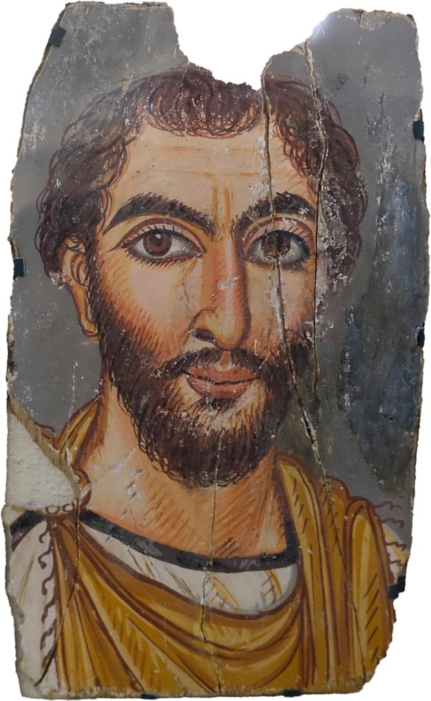 Portrait of a bearded man with brown hair. He has brown eyes and a pink tint to his lips. He is wearing a golden and white garment with a thin black lining around the collar. The background is gray.