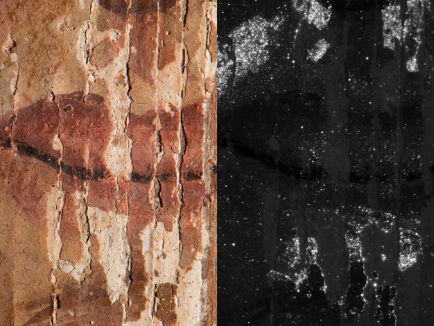 Two views of a close-up of a portrait around the lip area. In the visible light image to the left, the surface is heavily cracked and fractured, with paint layers visibly lifting and missing in vertical strips. The overall color palette is dominated by reddish-brown and ochre tones, representing the skin and lips. Lighter, creamy white areas are prominent where the top paint layers have flaked away, revealing the ground. The VIL image to the right is predominantly black. Numerous bright white spots are scattered across the surface, especially concentrated in areas where the paint is fractured or where highlights might have been applied.