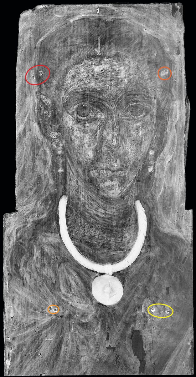 X-radiograph of a woman's portrait. Most of the paint appears gray except for the gold necklace and pendant, which are a vibrant white. The drilled and filled holes are circles. To the left of the woman's hair are two holes circled in red. On the exact other side of the woman's hair are two additional holes circled in orange. On the woman's chest, to the left of the pendant, is a hole circled in orange. On the exact other side of the pendant are two holes circled in yellow.