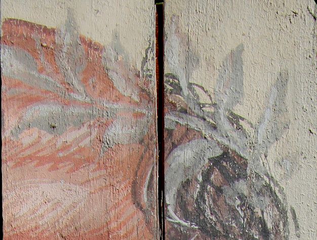 Visible light detail of a close-up image of the wreath in figure 5.3. The wreath is a white gray that stretches from the fading dark hairline across the pale and balding top of the old man's head. 