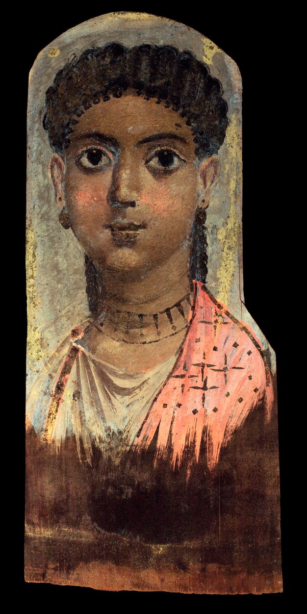 Ultraviolet-induced visible fluorescence image of a portrait of a young girl. The hair and skin of the girl featured on the portrait appear darker than they are in visible light. She has a noticeable bright pink tint to her cheeks, and slightly on her earlobes as well. Her earrings and necklace are dark brown, as well as her lips. Her garment appears bright pink and white, with dark brown star-like details on the right side. The ribbon-like vertical detailing on the left side appears dark, with a slight pink outline. The background is grey with specks of yellow. 