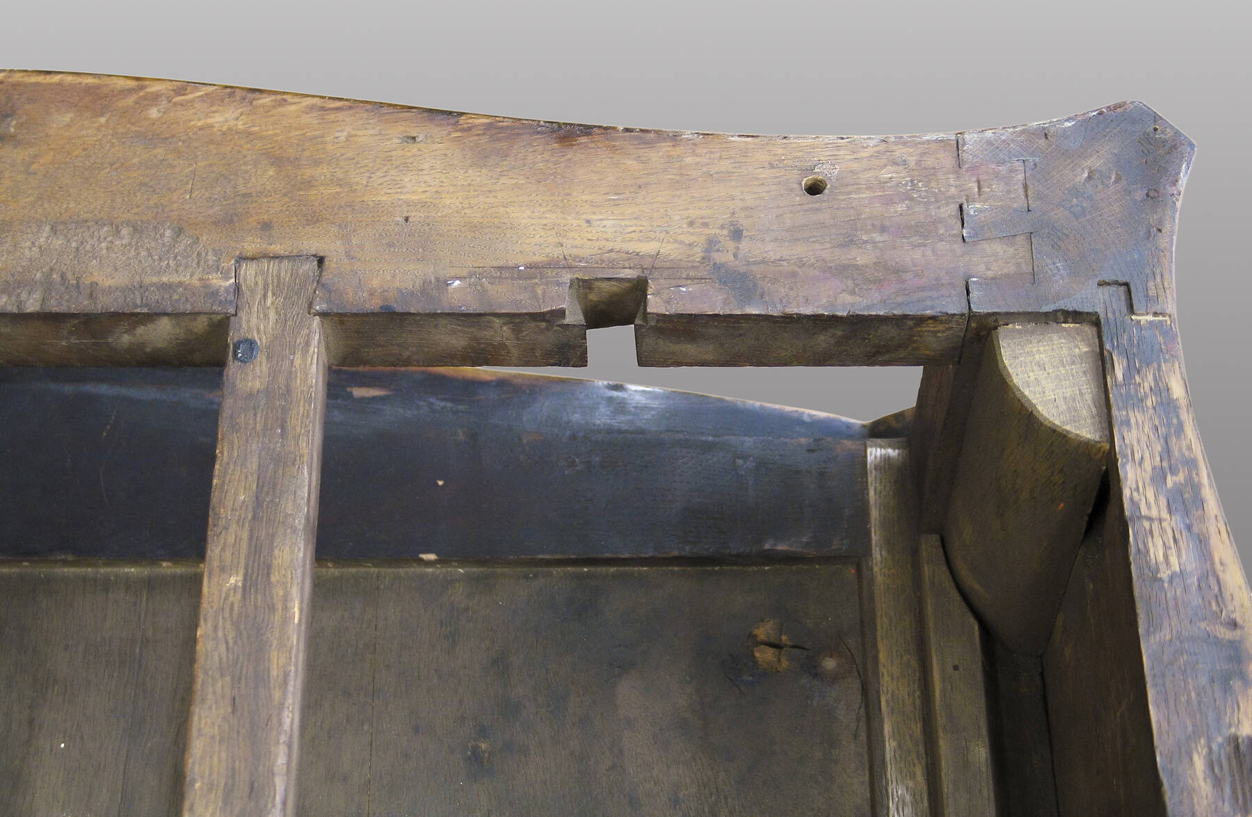 detail of corner joinery, revealing an extra dovetail mortise in the table’s frame