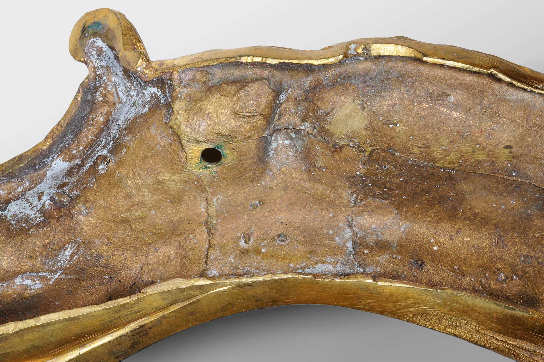 detail of one of the mounts from behind, revealing a smooth, sanded surface with a circular hole