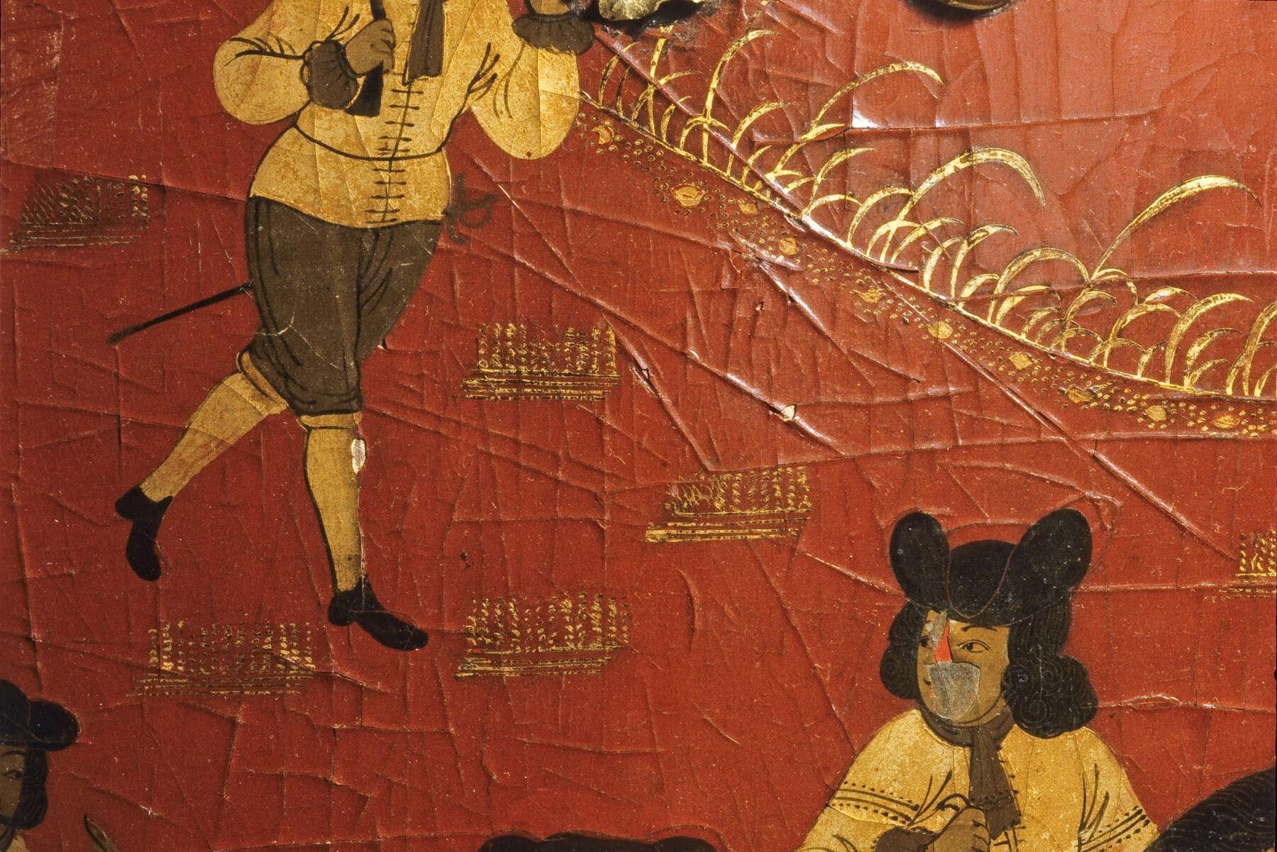 detail of one of the lacquer scenes, highlighting the many raised cracks in the surface