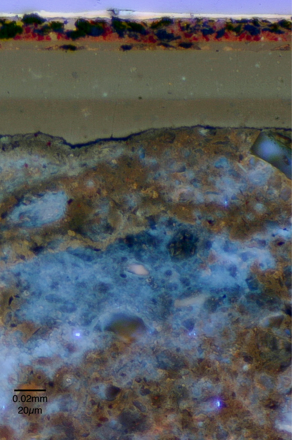 photomicrograph of the ground used in the other cabinet, shown as striations in various shades of black, red, beige, brown, and blue