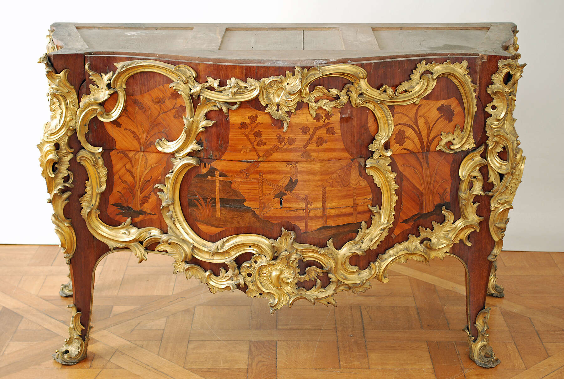 frontal view of an additional example of a paired commode, with the marble top removed