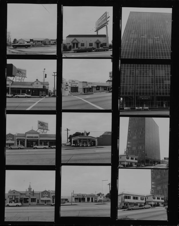 A contact sheet with twelve black-and-white photos of different buildings on a street.
