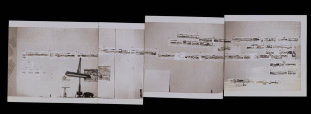 Four black-and-white photos have been taped together and show a continuous scene of a wall with several horizontal lengths of photos.