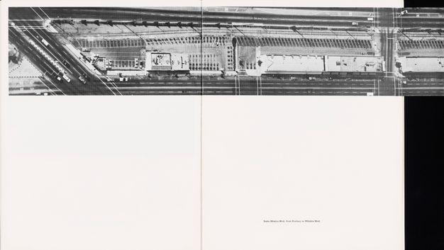 A two page spread of a book shows one long horizontal strip of black-and-white photos of a parking lot along the top. The photo extends beyond the spread on a flap.