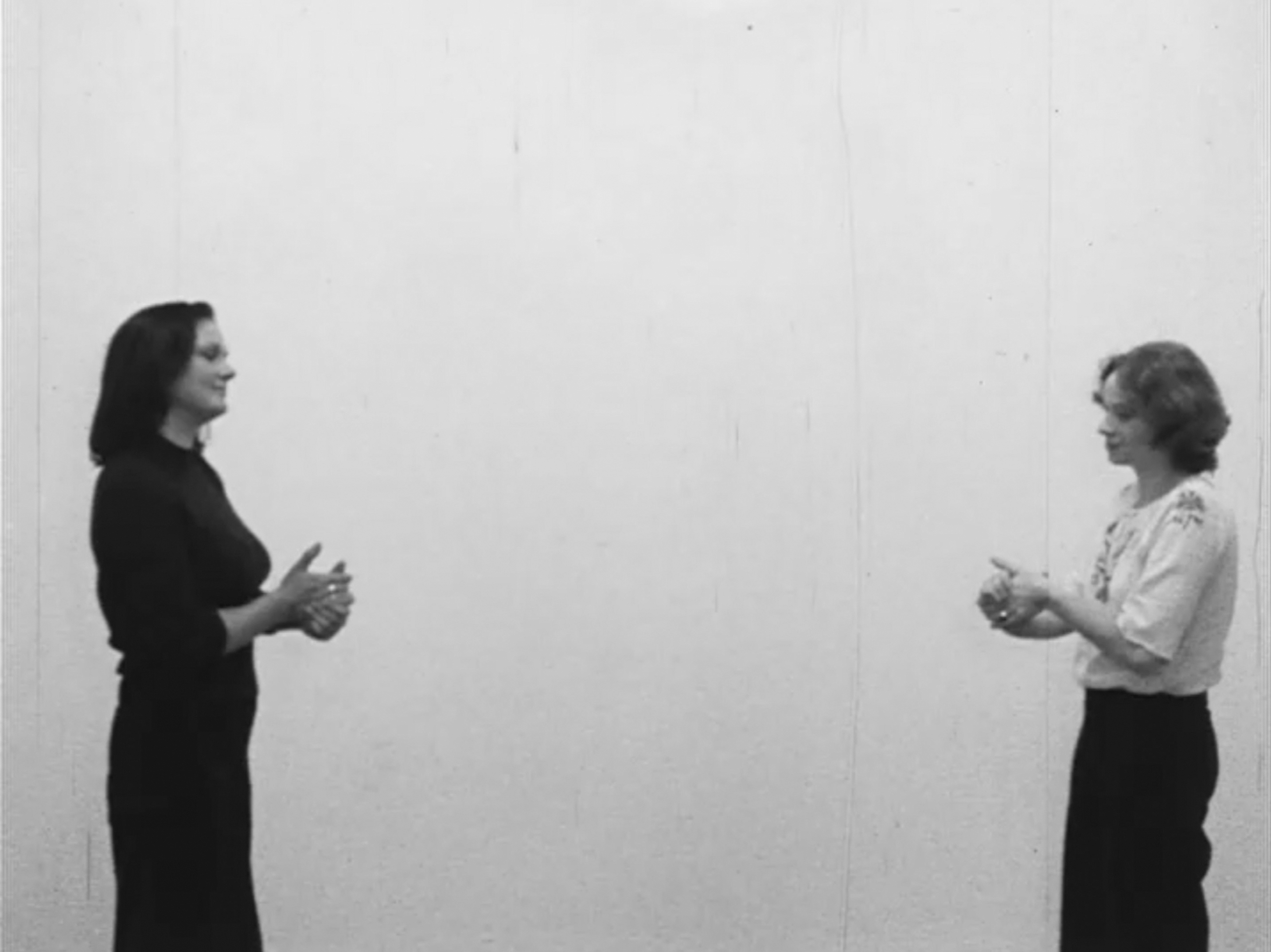 Color film opening with a male voiceover that introduces the video and then describes an activity between two participants. Shots then show various people acting out these activities. During the activity, one person asks the other the question, is it warm yet? The activity continues until the actor says that the activity is warm. This cycle continues throughout the film. 4 by 3 aspect ratio.