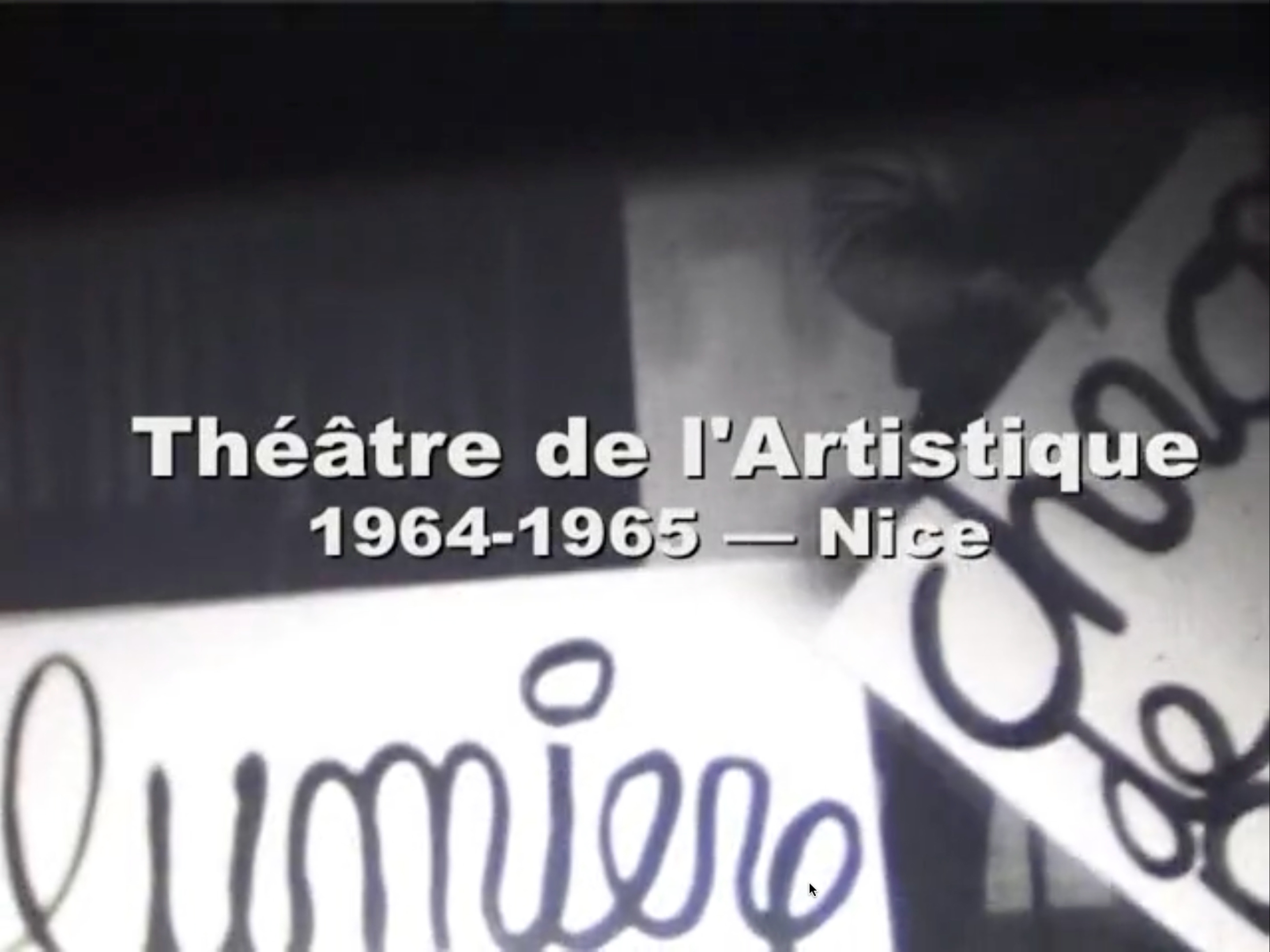 Black-and-white film depicting seated audience members in an auditorium pulling segments of paper from a large roll of paper positioned near the stage and passing them all the way to the back of the hall. More and more audience members stand up as the space becomes littered with paper all around. Voiceover by Ben Vautier (added at a later date) describes with laughter the performance and audience members’ reactions.