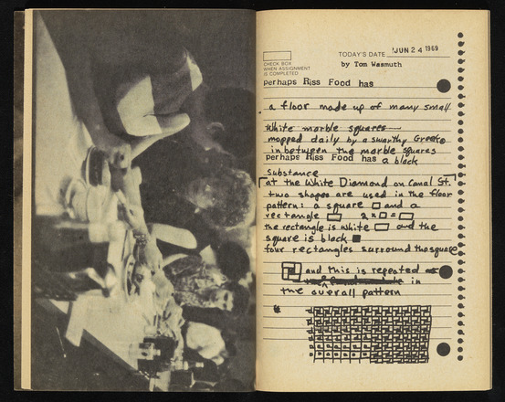 Two-page spread in notebook. Left page contains landscape-oriented black and white photograph of four people eating at a long table. Right page contains photocopy of lined notebook paper filled with handwritten and typewritten black text. Top right margin contains date and “by Tom Wasmuth.” Diagram of tessellated squares on bottom quarter.