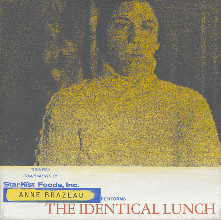 Square-shaped canvas with yellow and black photo print close up on top three quarters of a woman shot from shoulders up in white turtleneck looking straight to camera. Bottom quarter contains blue text “Tuna Fish Compliments of” and “Star-Kist Foods, Inc.” the latter appearing like the official logo. “Anne Brazeau performs The Identical Lunch” below in yellow, blue, and red.