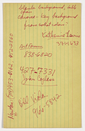 Vertical yellow lined index card with handwritten names, telephone numbers, and notes in red pen. 