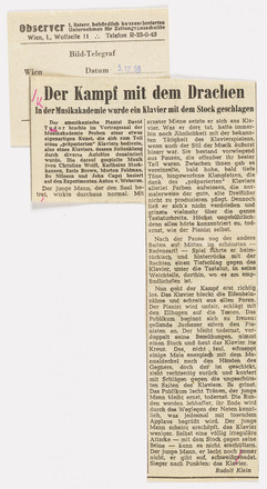 Press clipping with two columns of text in German. Title “Der Kampf mit dem Drachen” in large font above both columns of text, consisting of four long paragraphs.