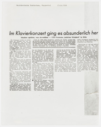 Photocopy of press clipping containing four columns of text in German on white page. Title “Im Klavierkonzert ging es absunderlich her” across top of all columns. Photocopy covers three-quarters of the page.