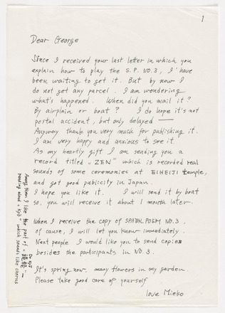 Grey, white-flecked page with black handwritten text in English addressed “Dear George” at top left, followed by two paragraphs and one sentence that spans the length of the page. Text has one written annotation in left margin. Signed “love Mieko” at bottom right and paginated 1 at top left.