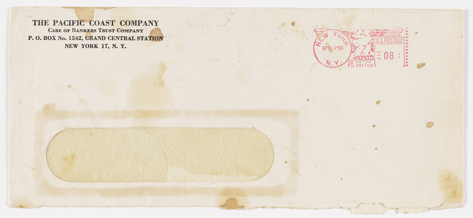 Recto of rectangular white envelope stained with flecks of brown. Printed address for the Pacific Coast Company at top left, ink stamp at top right, and clear film window at bottom left. 