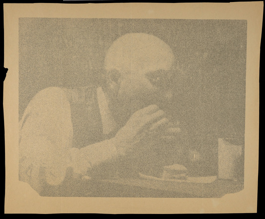 Square-shaped canvas with yellow and black photo print on top three quarters of man, in profile, eating a sandwich held to his mouth in both hands. Bottom quarter contains blue text “Tuna Fish Compliments of” and “Star-Kist Foods, Inc.” the latter appearing like the official logo. “George Maciunas performs The Identical Lunch” below in yellow, blue, and red.