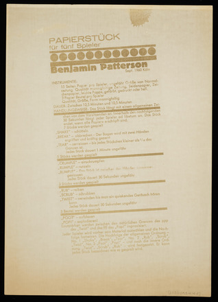 Black-and-white photocopy of vertical rectangular page with printed text in German. Titled “Papierstück für fünf Spieler “ at top left followed by a horizontal line of large circles and “Benjamin Patterson” in bold font. The page is broken into five sections by bold horizontal lines, each with five to six lines of text instructions for performance. Many lines begin with transitive verbs such as “TEAR” and “RUMPLE.” Bottom quarter of page blank. Large boarders surround all four sides of the photocopy.