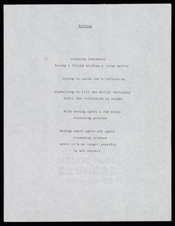 White page with black typewritten text in English, center-justified, attached to other pages with a staple in upper-left corner. Some pages are notated in pencil.