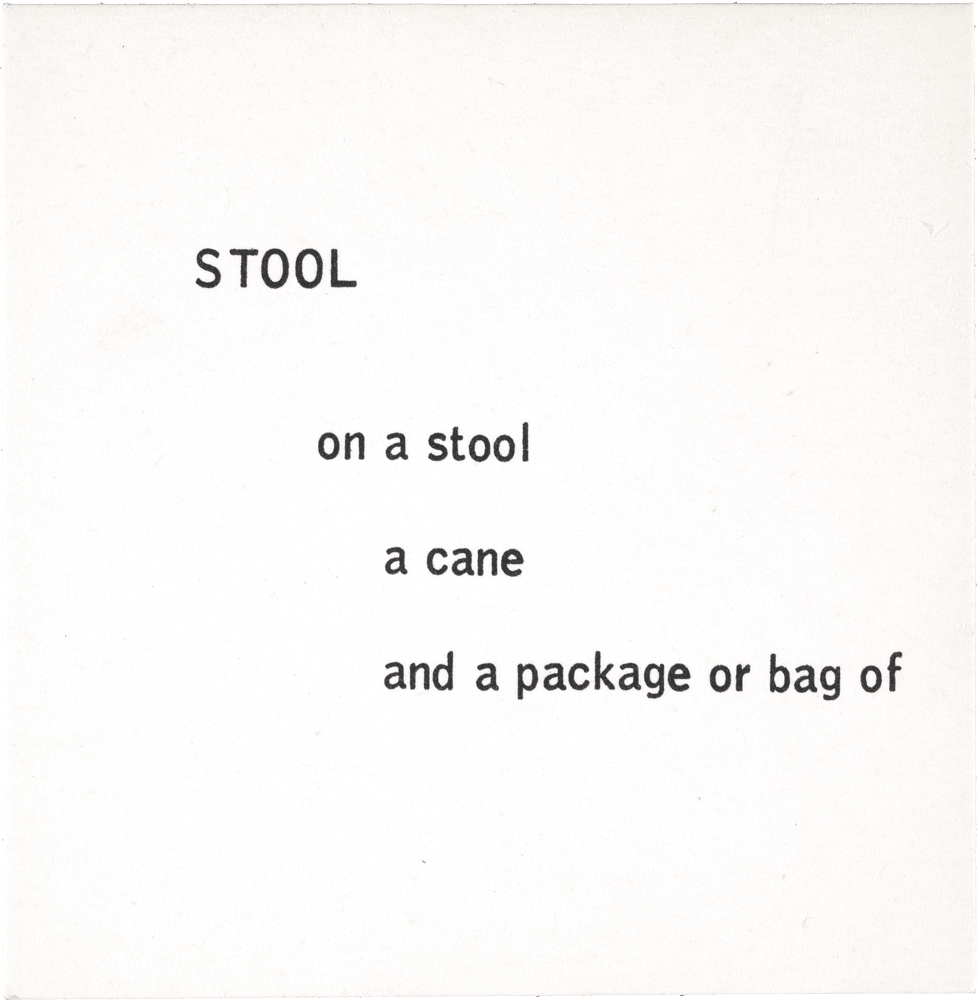 Stool: on a stool a cane and a package or bag of