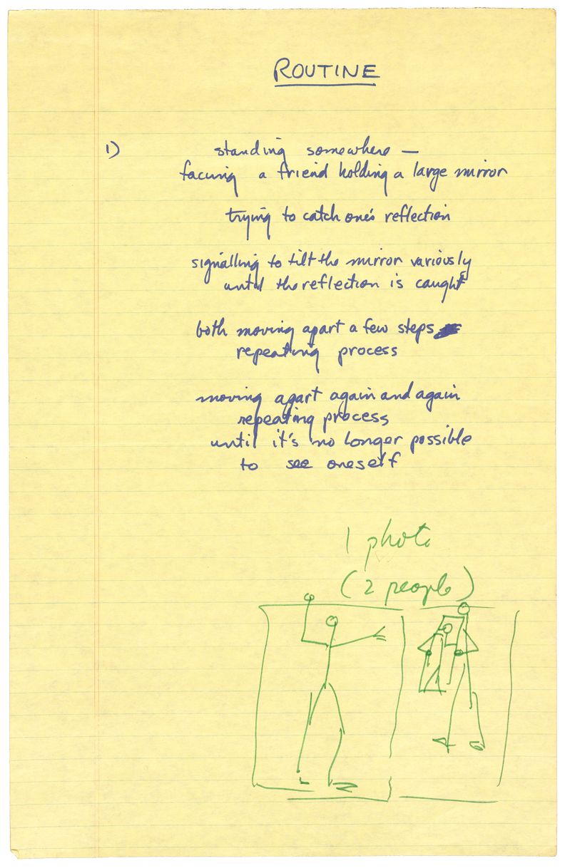 A piece of yellow lined paper with writing in blue ink. A title, Routine, is written at the top, followed below by the number 1, and five blocks of short text. At the bottom in green ink is a stick figure standing next to another stick figure holding a mirror, reflecting the first stick figure. Text above reads 1 photo, 2 people.