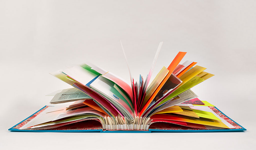 The splayed pages of this book, composed of flyers and pamphlets from labor rights organizations in Southern California, flare out in a colorful semicircular array.