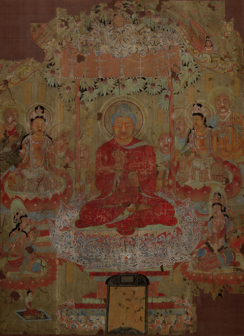 Image of the Buddha seated beneath a jeweled canopy, preaching to disciples and bodhisattvas