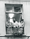 photo of students looking out open windows in the cooking school