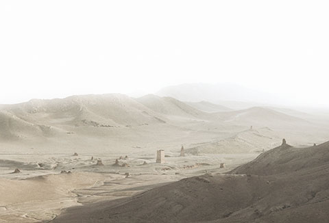 A color photograph of the Valley of the Tombs ancient site in Palmyra, Syria. 